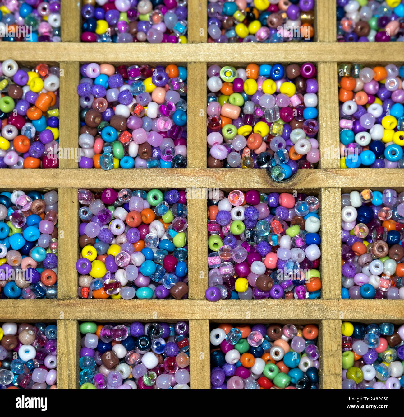 Multi coloured threading beads on display Stock Photo Alamy