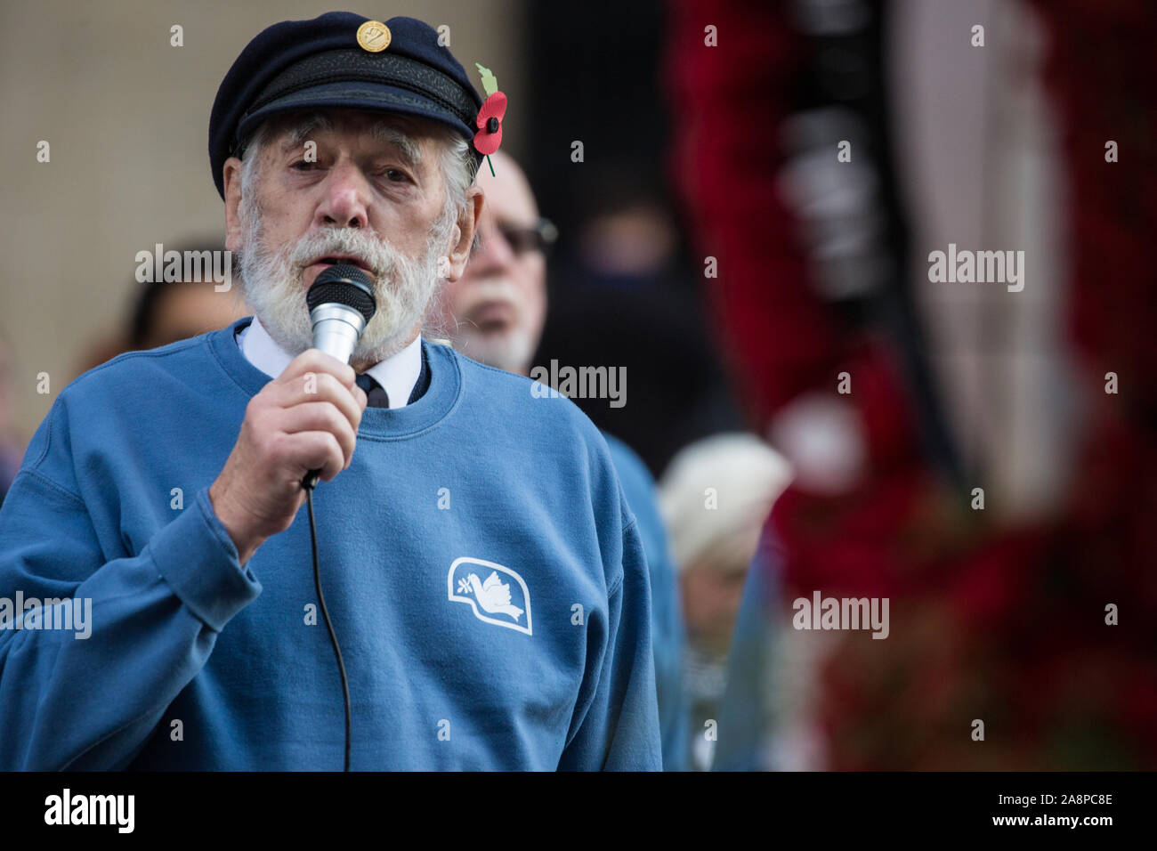 London, UK. 10 November, 2019. Jim Radford (c), D-Day veteran and folk singer, sings ‘1916’ in front of ex-services personnel from Veterans For Peace UK (VFP UK) taking part in the Remembrance Sunday ceremony at the Cenotaph. VFP UK was founded in 2011 and works to influence the foreign and defence policy of the UK for the larger purpose of world peace. Credit: Mark Kerrison/Alamy Live News Stock Photo