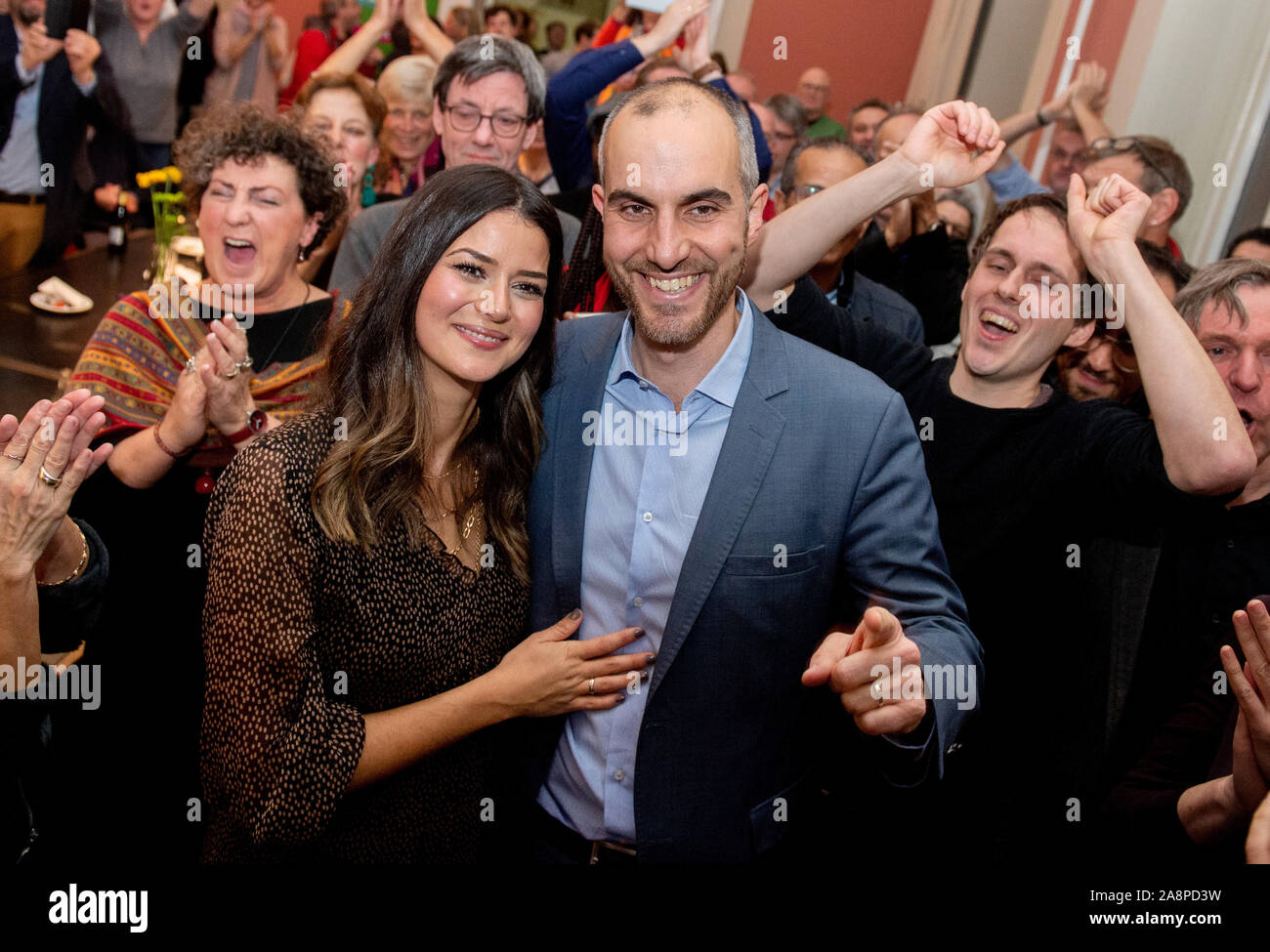 Hanover, Germany. 10th Nov, 2019. Belit Onay (Bündnis 90/Die Grünen), top candidate in the mayoral election, is pleased with his wife Derya (l) and his supporters after the announcement of the election results. Since none of the ten candidates received more than 50 percent of the votes in the first ballot on 27 October 2019, a run-off ballot was held. Credit: Hauke-Christian Dittrich/dpa/Alamy Live News Stock Photo