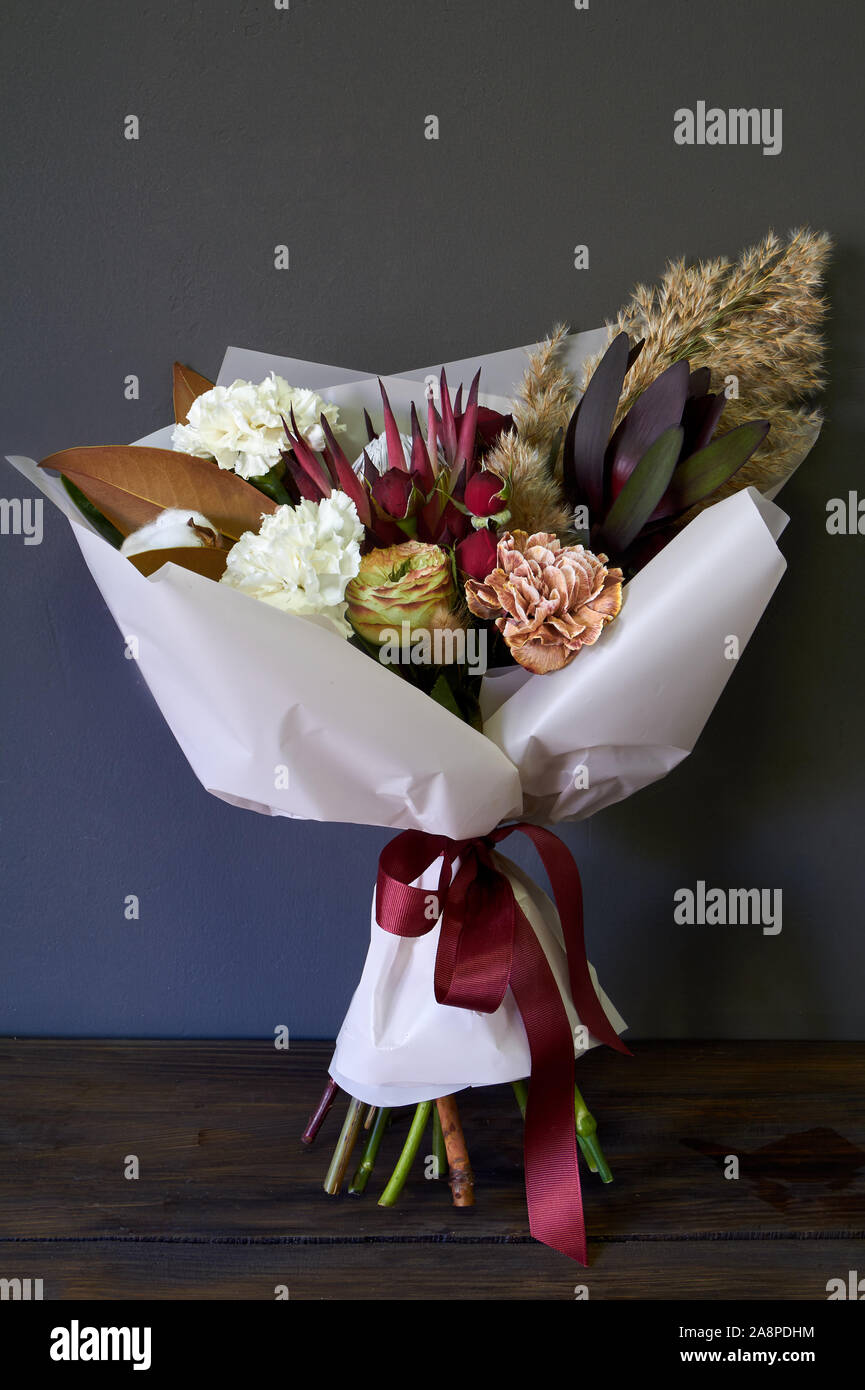 Close-up of bouquet decorated in vintage style on a dark background, selective focus Stock Photo