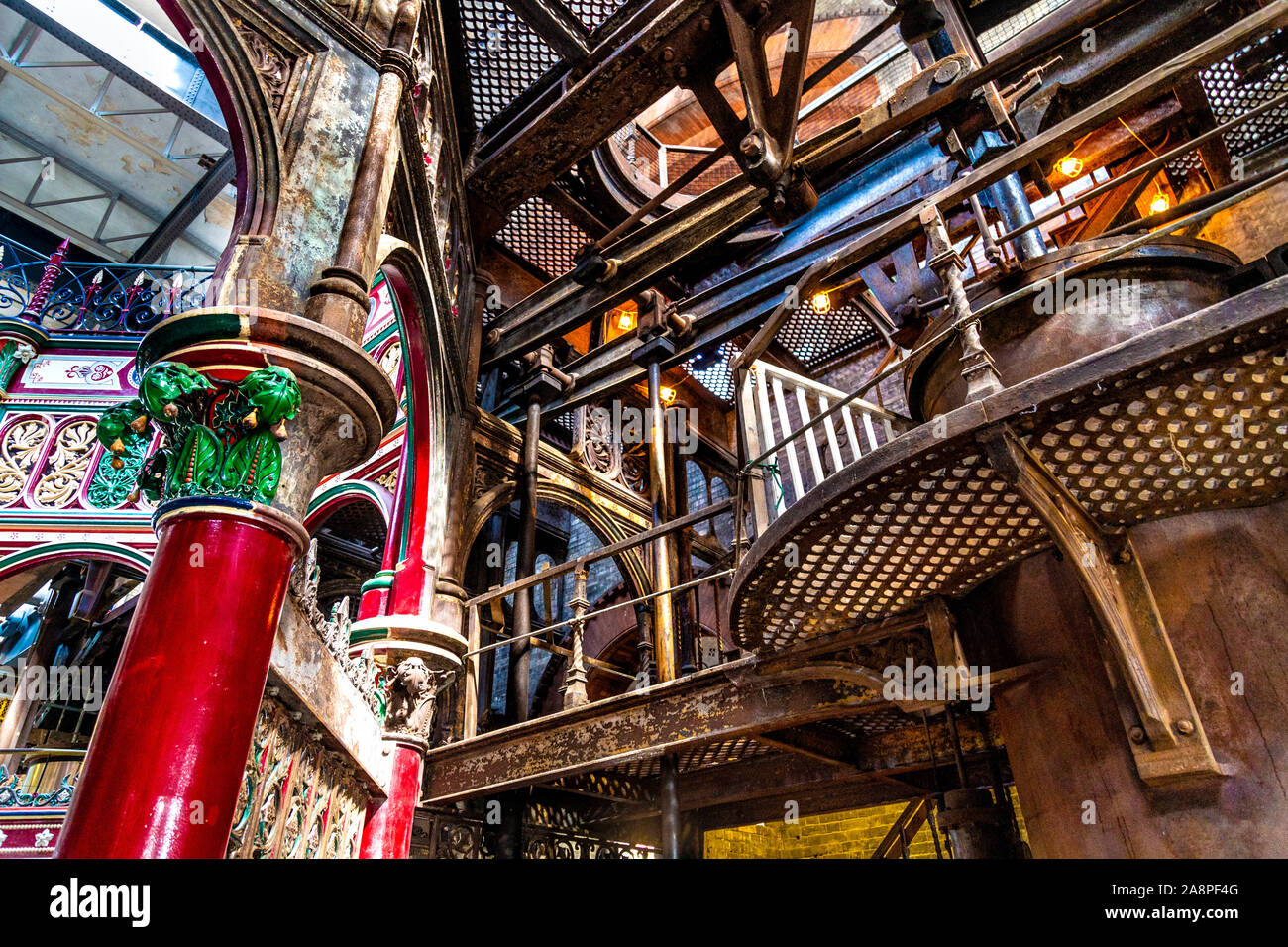 Partially restored colourful decorative ironwork of The Octagon at the Victorian Crossness Pumping Station, UK Stock Photo