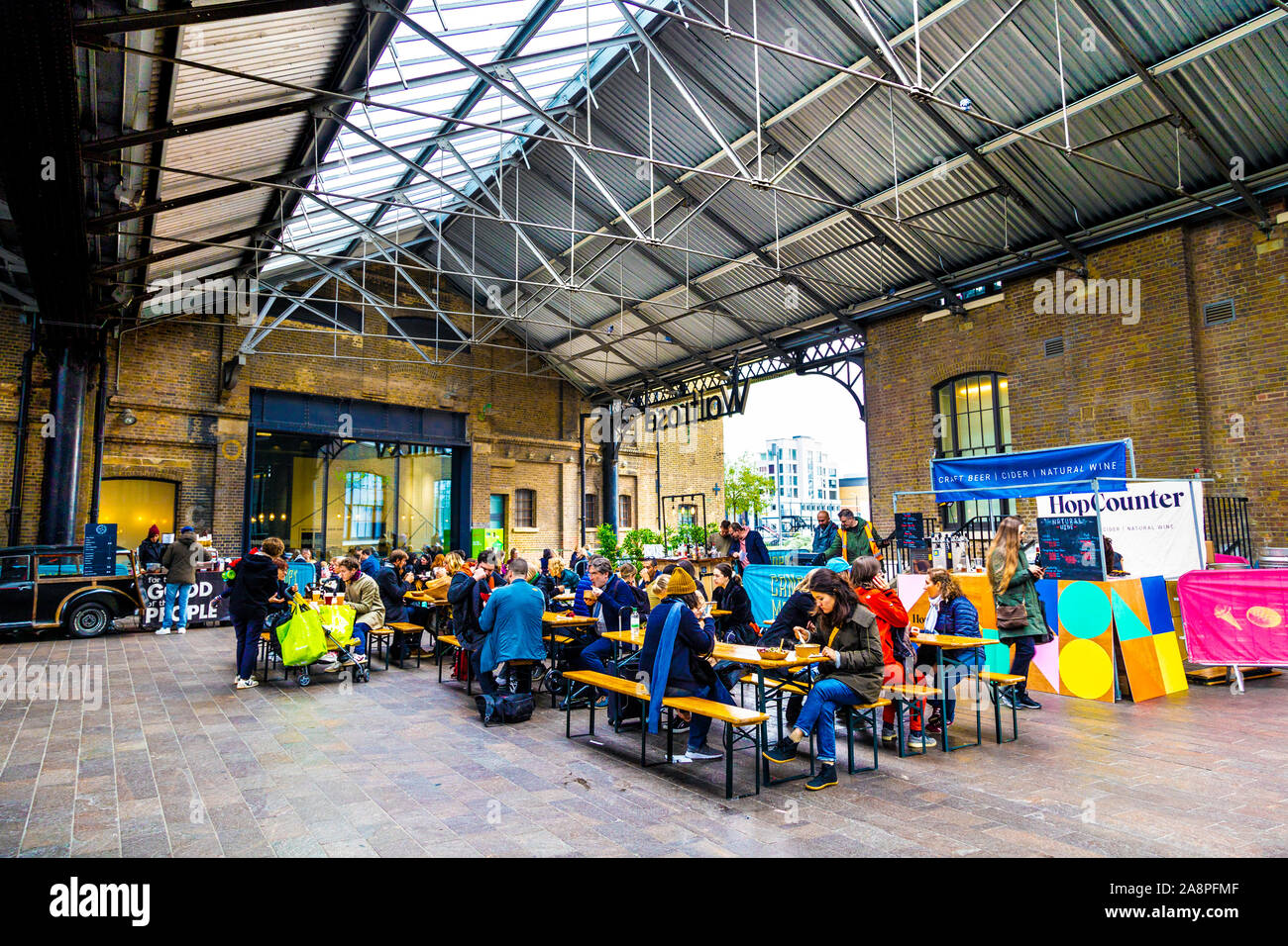 People eating at Canopy Market in Kings Cross, London, UK Stock Photo