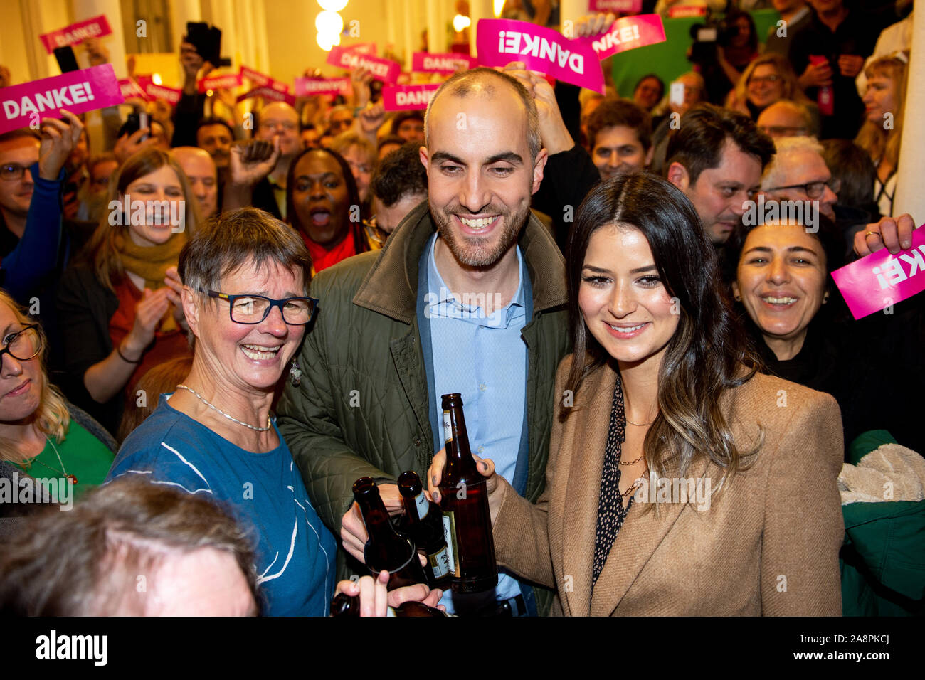 Hanover, Germany. 10th Nov, 2019. Belit Onay (Bündnis 90/Die Grünen), winner of the mayor's election, celebrates with his wife Derya (r), Gisela Witte (l), chairwoman of the city association Bündnis 90/Die Grünen, and his supporters at the election party in the Alten Magazin. Since none of the ten candidates received more than 50 percent of the votes in the first ballot on 27 October 2019, a run-off ballot was held. Credit: Hauke-Christian Dittrich/dpa/Alamy Live News Stock Photo