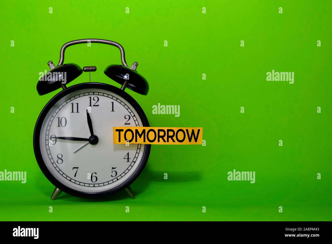 Tomorrow write on sticky note isolated green background ...