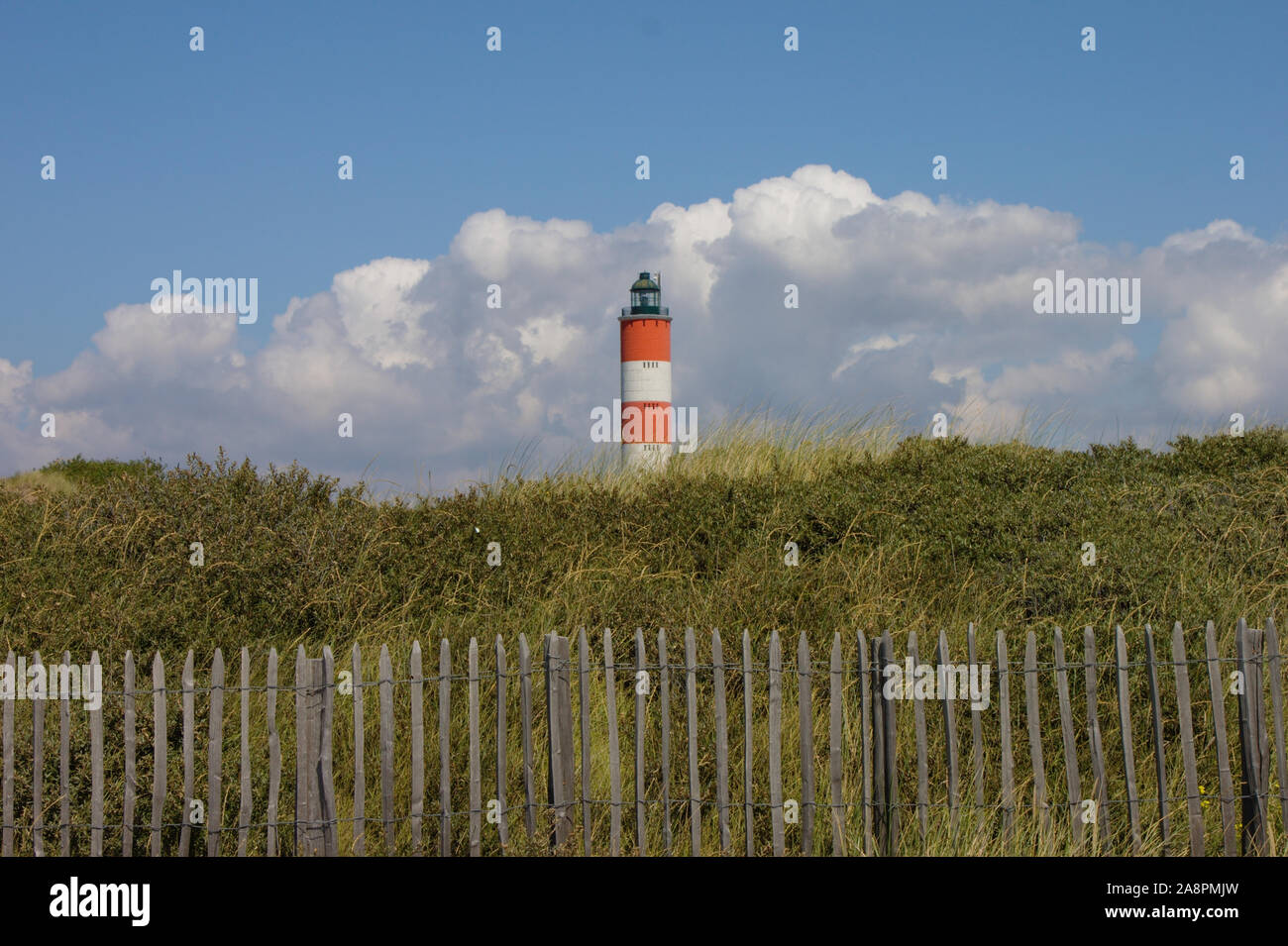 The lighthous "Phare de Berck" is located on the dunes behind the promenade of Berck, France. Stock Photo