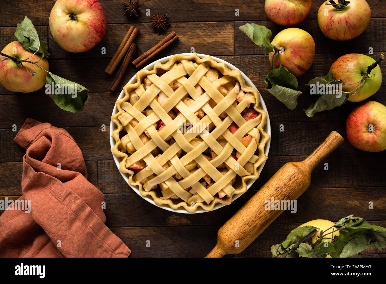 Apple pie with lattice top on wooden background, table top view. Rustic american apple pie Stock Photo