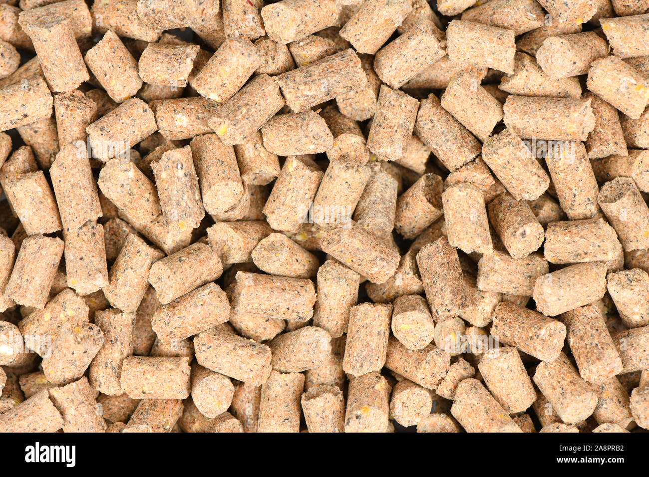 Brown pellets for carp fishing background. High resolution photo