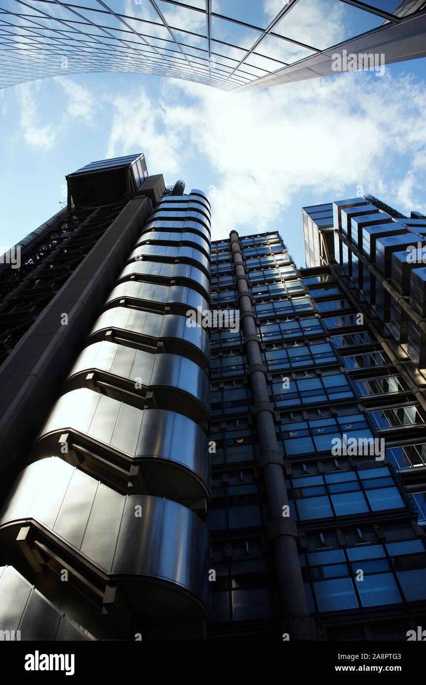 LONDON - MAY 3, 2012: The exterior of the Lloyd's building, finished in 1986, shines under bright blue sky. Stock Photo