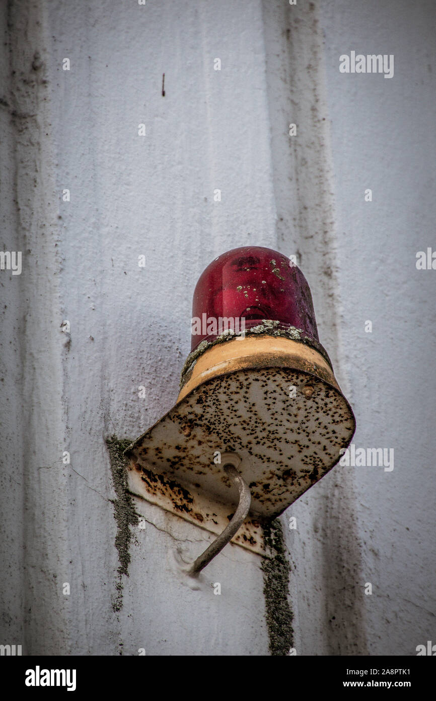 Taking a stroll through the iconic 1970s building Ihmezentrum in November 2019. Closeup of an old and moldy alarm signal lamp. Stock Photo