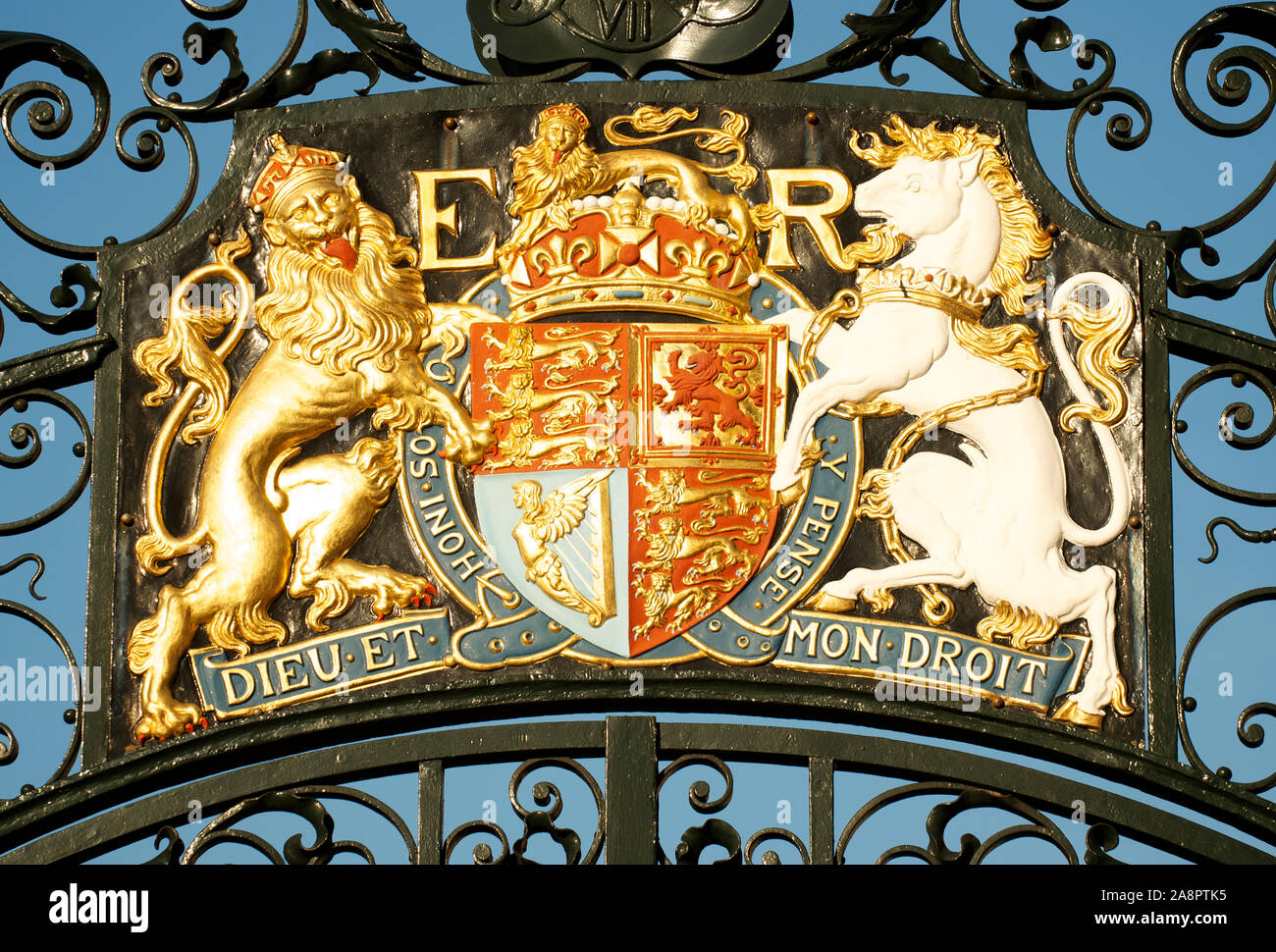 Full frame close-up of the royal coat of arms of the United Kingdom, featuring a golden lion and unicorn on either side of a shield Stock Photo