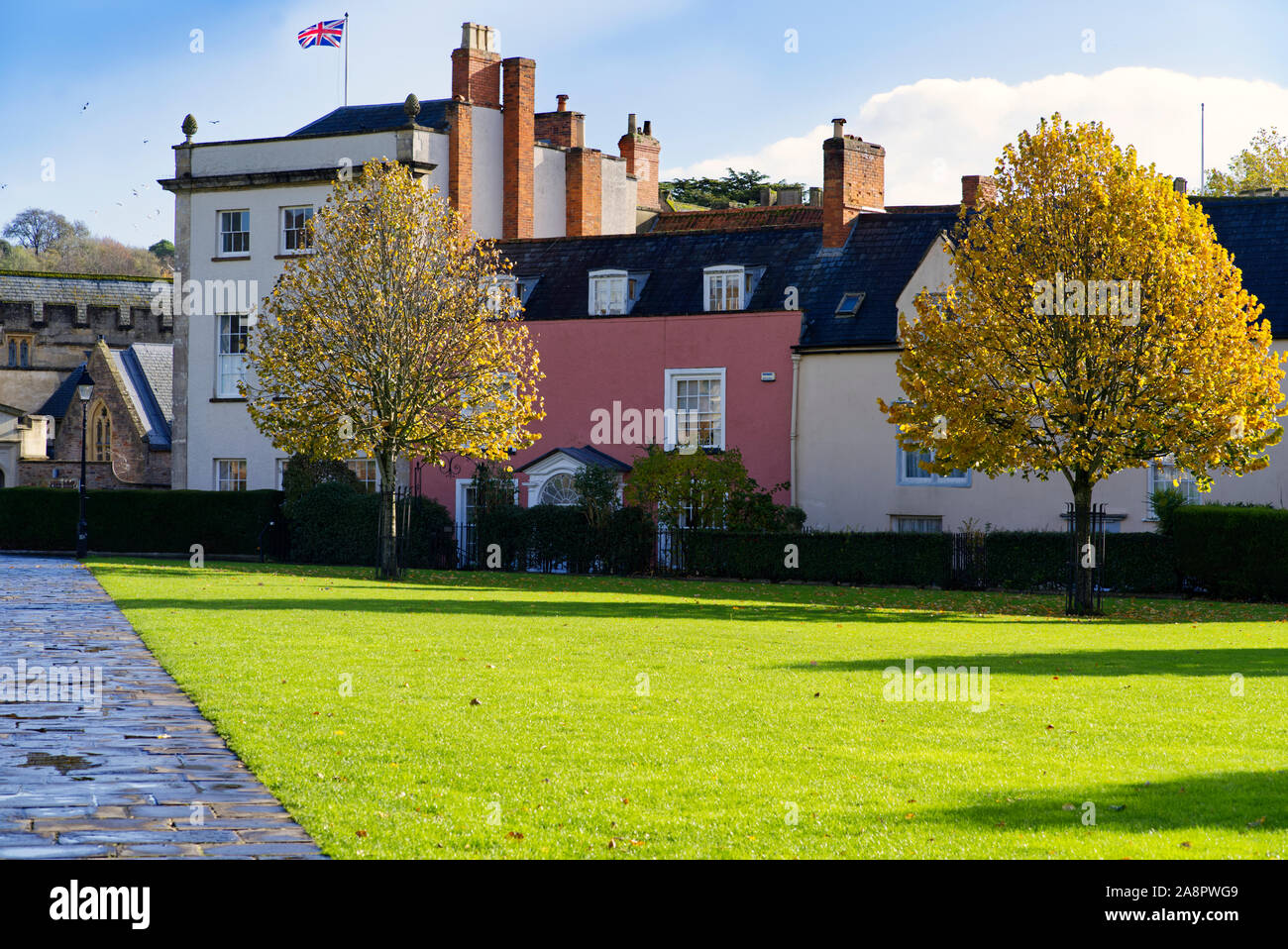 Terraced houses facing the Wells Cathedral Green Stock Photo Alamy