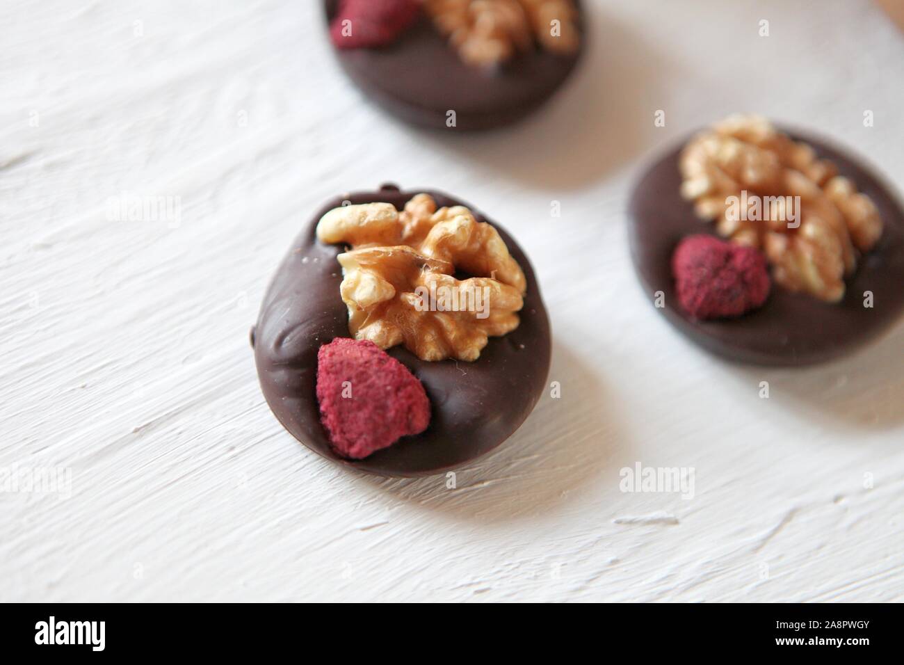 Dark chocolate with nuts, dry fruits homemade candies. Delicious snak