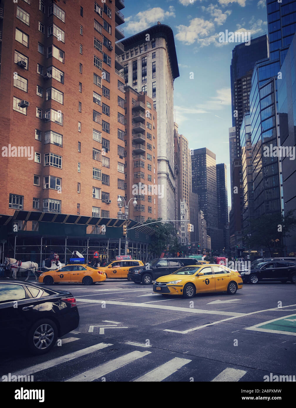Street scene with buildings, cars and taxis in New York City, USA Stock ...