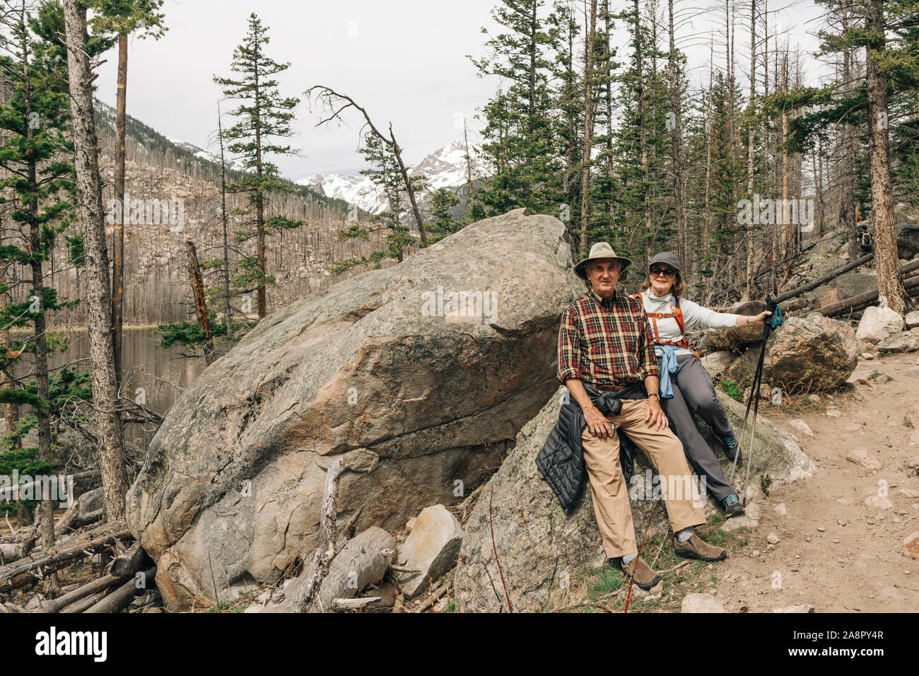 An older couple enjoy a hike in Rocky Mountain National Park, Colorado Stock Photo