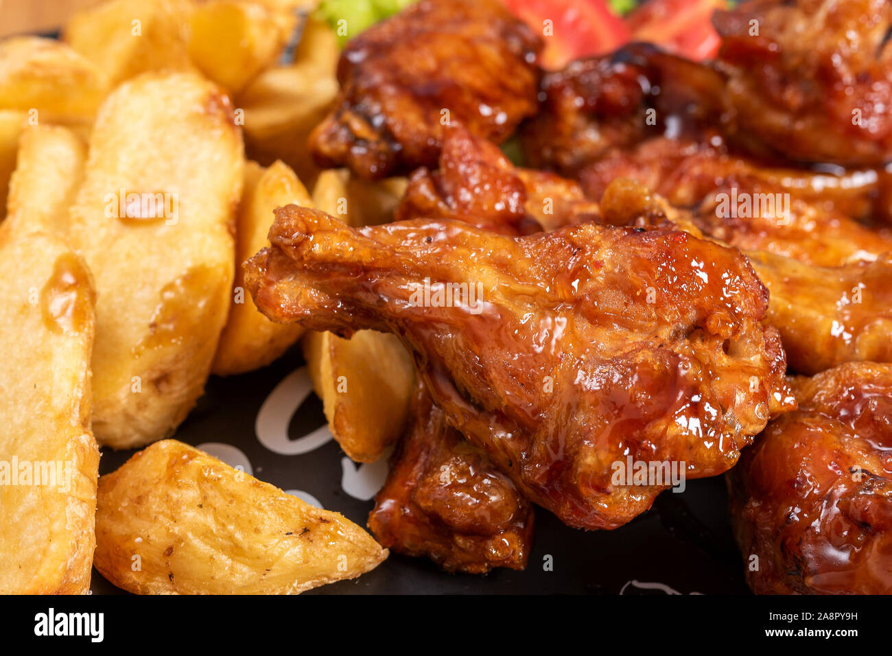 Chicken wings in sweet and sour sauce Stock Photo Alamy