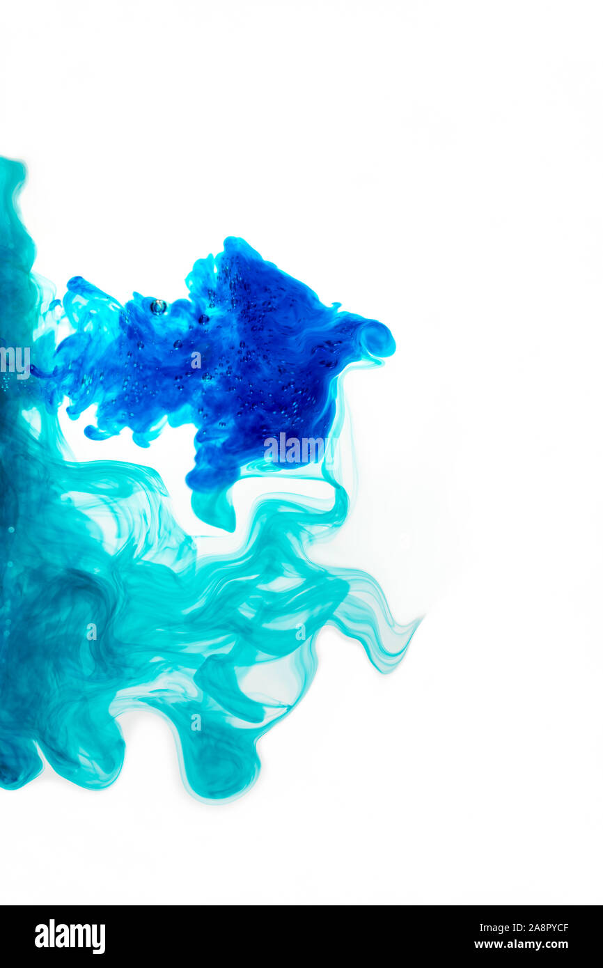 Blue, fluid, ink, which dissolves in water on a white background Stock
