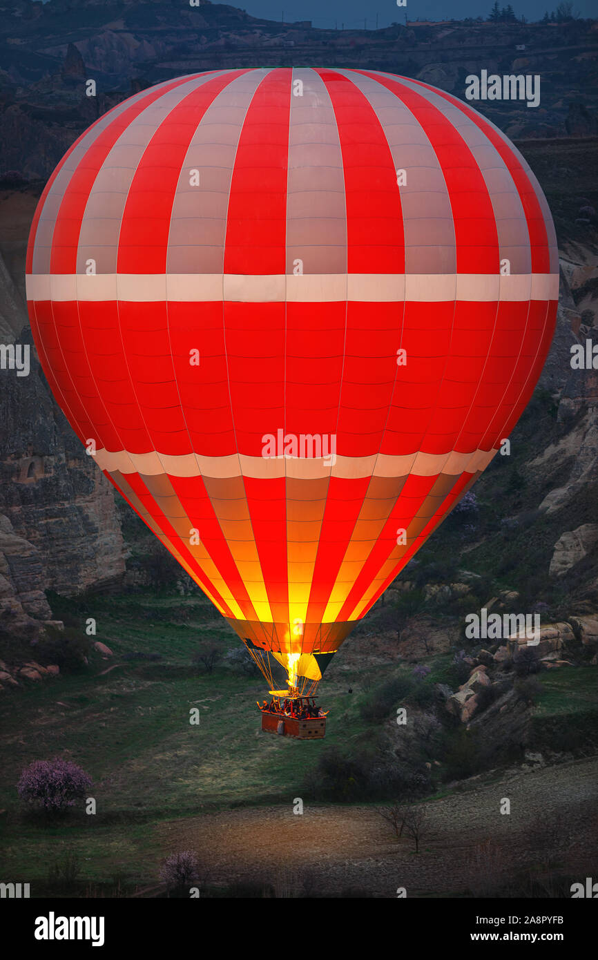 Hot air balloon flying over the valley at Cappadocia, Turkey Stock ...