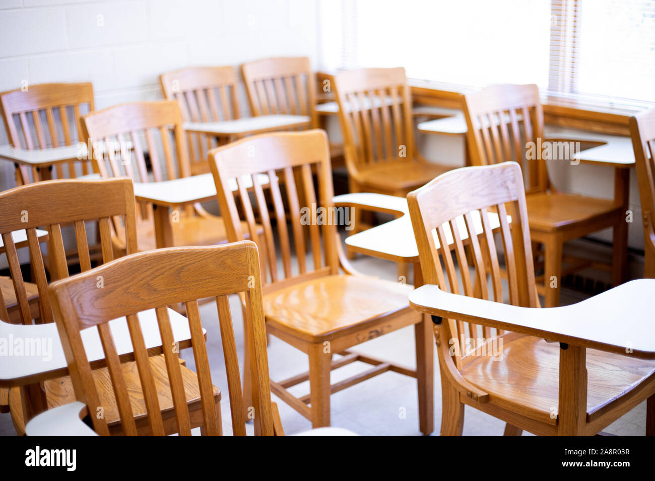 Empty desks in a classroom Stock Photo
