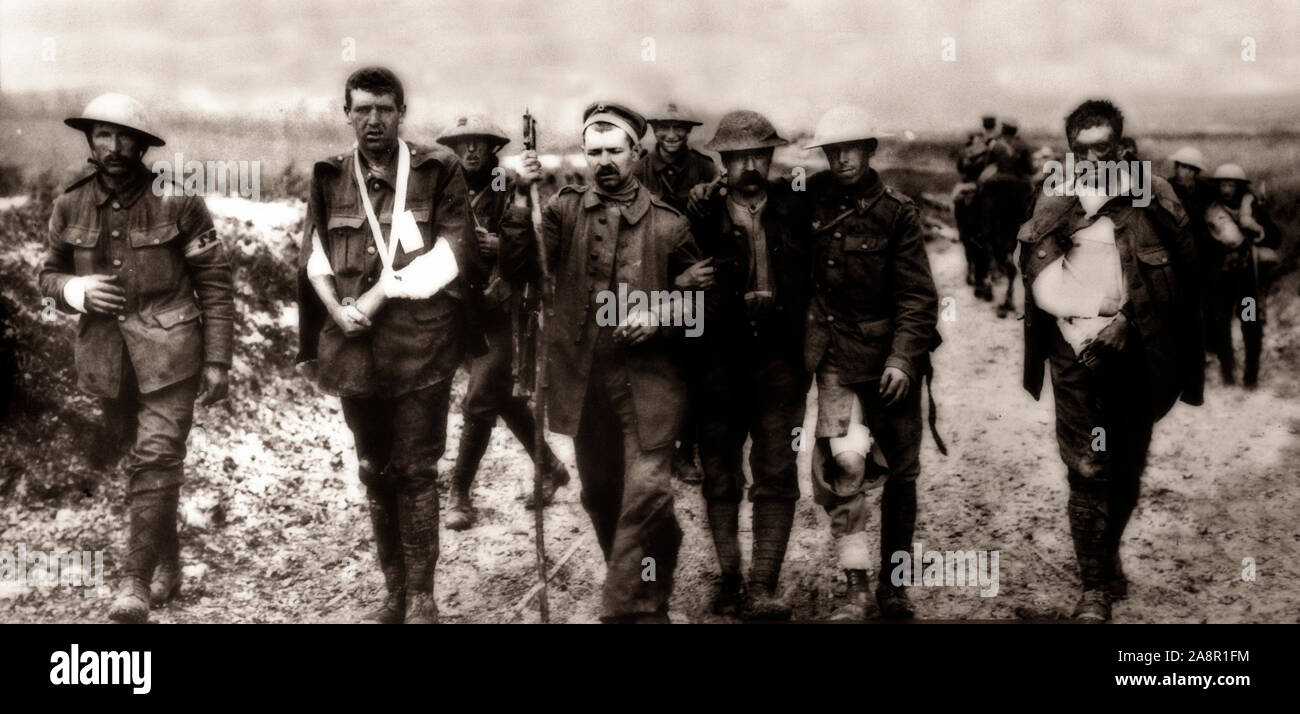 Wounded British and German troops make for a field hospital of war during the Battle for Bezentin Ridge during the Somme Offensive, fought by the armies of the British Empire and French Third Republic against the German Empire. It took place between 1 July and 18 November 1916 on both sides of the upper reaches of the River Somme in France. In the battle, the largest battle of the war's Western Front, more than three million men fought and one million men were wounded or killed, making it one of the bloodiest battles in human history. Stock Photo