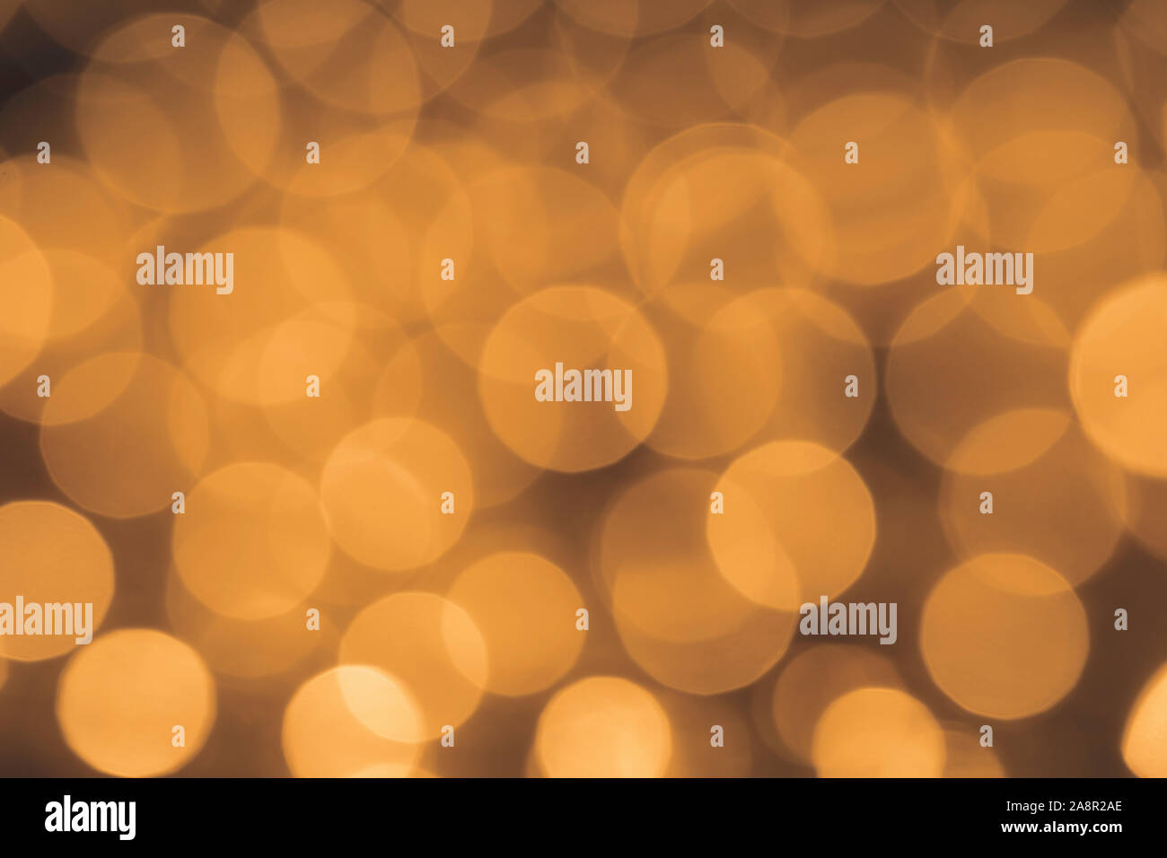 Christmas lights out of focus only the bokeh. Golden circles. Abstract background. Stock Photo