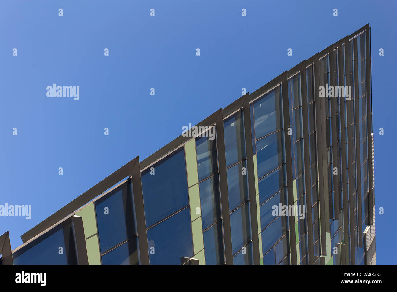 Office building facade in Assago (Milano, Italy), no people are visible; background is a blue daylight sky Stock Photo