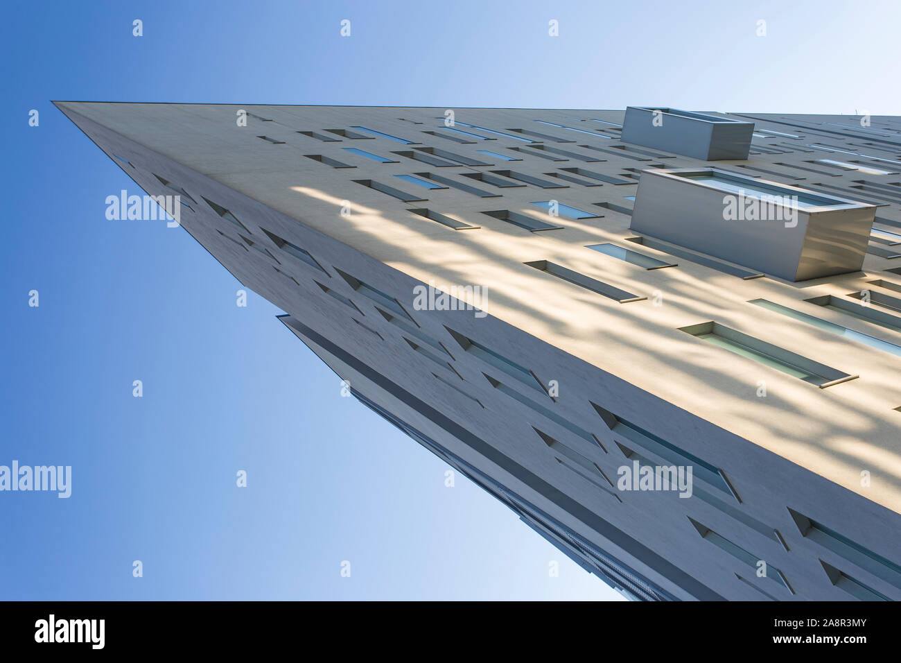 Office building facade in Assago (Milano, Italy), no people are visible; background is a blue daylight sky Stock Photo