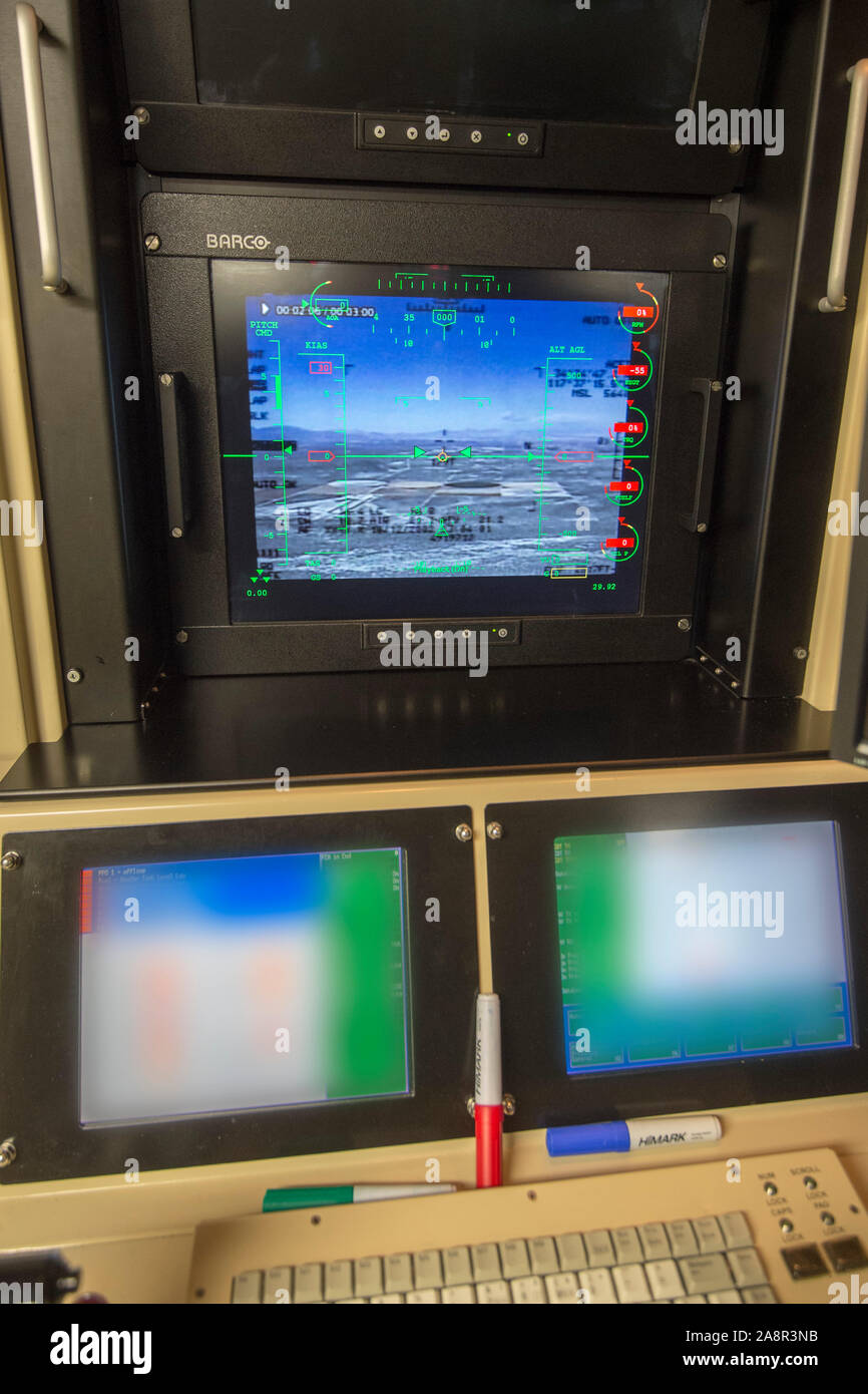 Pilots view in the high security Aircraft Hangar at RAF Waddington in Lincolnshire where Pilots seated behind banks of screens in an air-conditioned cabin,  use satellite links to control  unmanned 'Reaper' drone aircraft flying nearly constant armed reconnaissance missions over Iraq and Syria. November 2015 Stock Photo