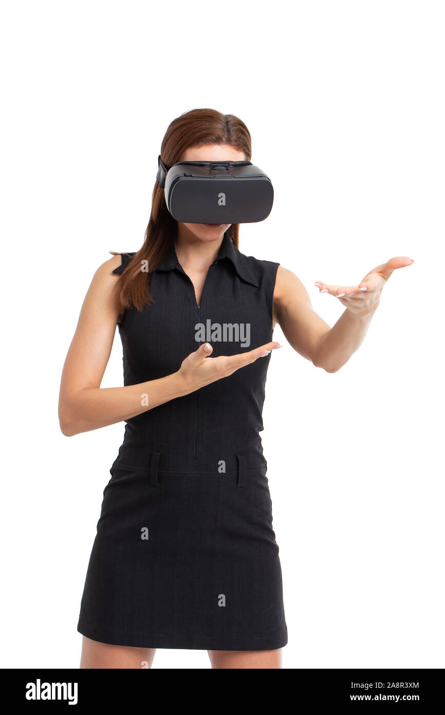 Young Caucasian woman using VR headseat, touching with hands, isolated on white Stock Photo