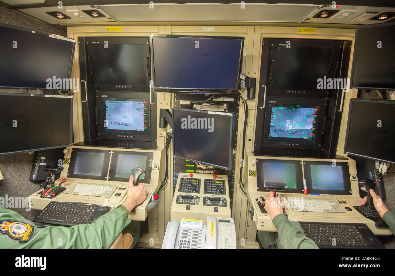 Pilots view in the high security Aircraft Hangar at RAF Waddington in Lincolnshire where Pilots seated behind banks of screens in an air-conditioned cabin,  use satellite links to control  unmanned 'Reaper' drone aircraft flying nearly constant armed reconnaissance missions over Iraq and Syria. November 2015 Stock Photo