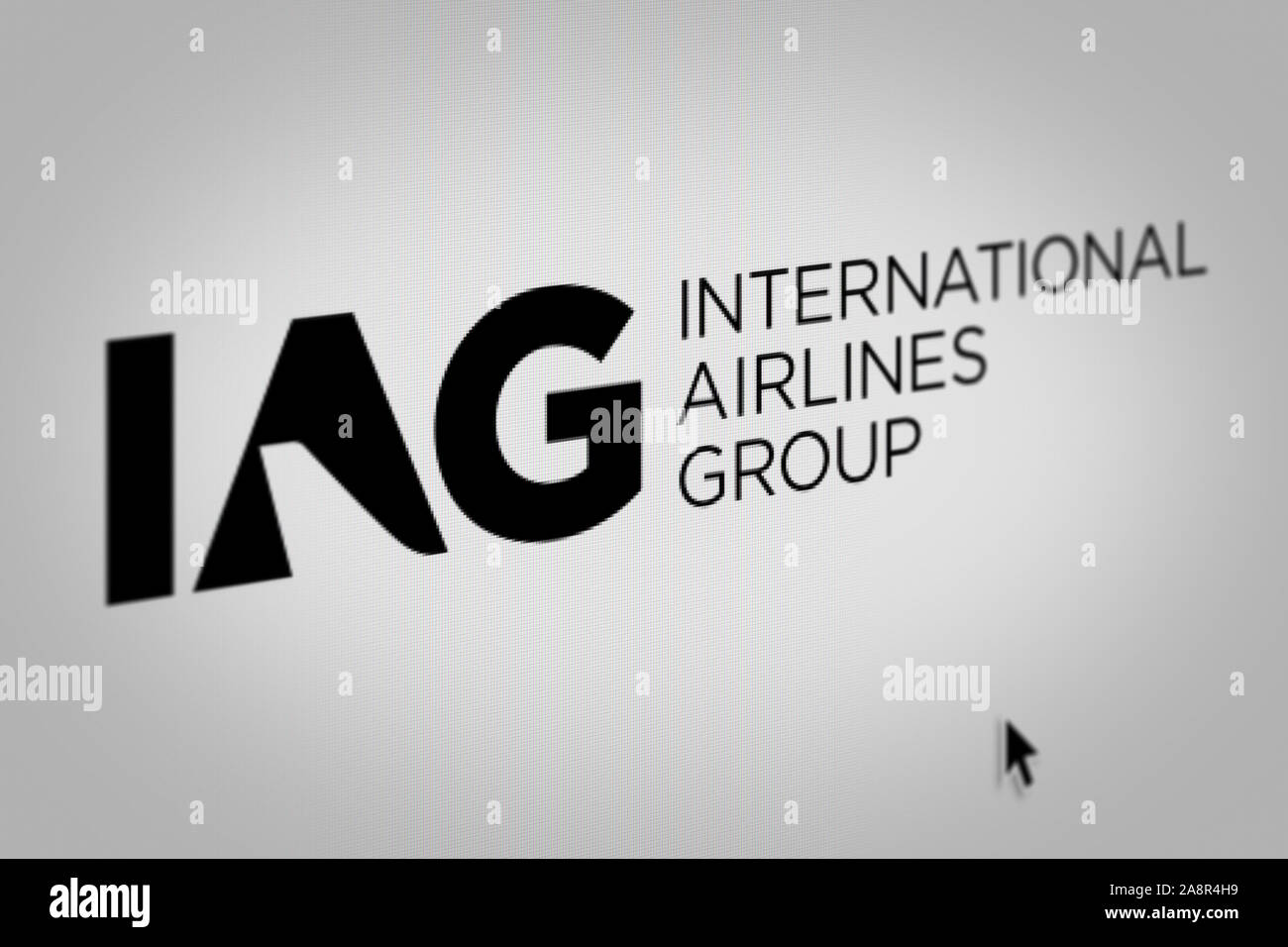 Logo of the public company International Airlines Group displayed on a computer screen in close-up. Credit: PIXDUCE Stock Photo