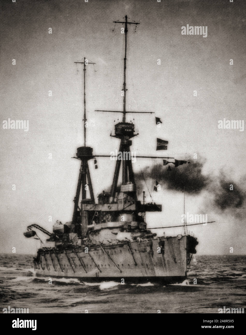 HMS Inflexible, an Invincible-class battlecruiser of the British Royal Navy was built before World War I. She and her sister ship Invincible sank the German armoured cruisers SMS Scharnhorst and SMS Gneisenau during the Battle of the Falkland Islands. Later transferred to the Grand Fleet afterwards, she damaged the German battlecruiser Lützow during the Battle of Jutland and watched Invincible explode. Stock Photo