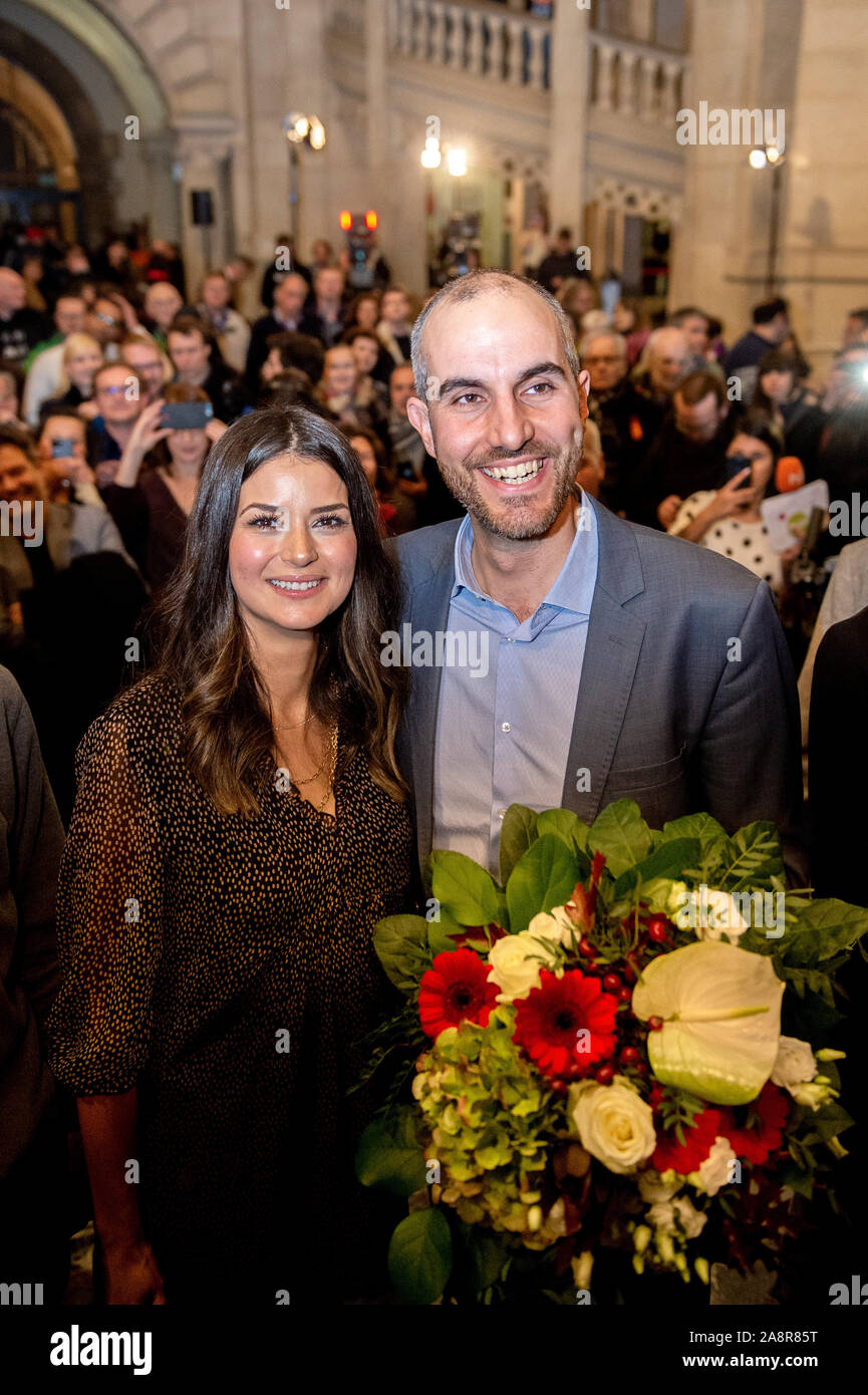 Hanover, Germany. 10th Nov, 2019. Belit Onay (Bündnis 90/Die Grünen), top candidate in the mayoral election, is standing with his wife Derya in the town hall after the announcement of the election results. Since none of the ten candidates received more than 50 percent of the votes in the first ballot on 27 October 2019, a run-off ballot was held. Credit: Hauke-Christian Dittrich/dpa/Alamy Live News Stock Photo