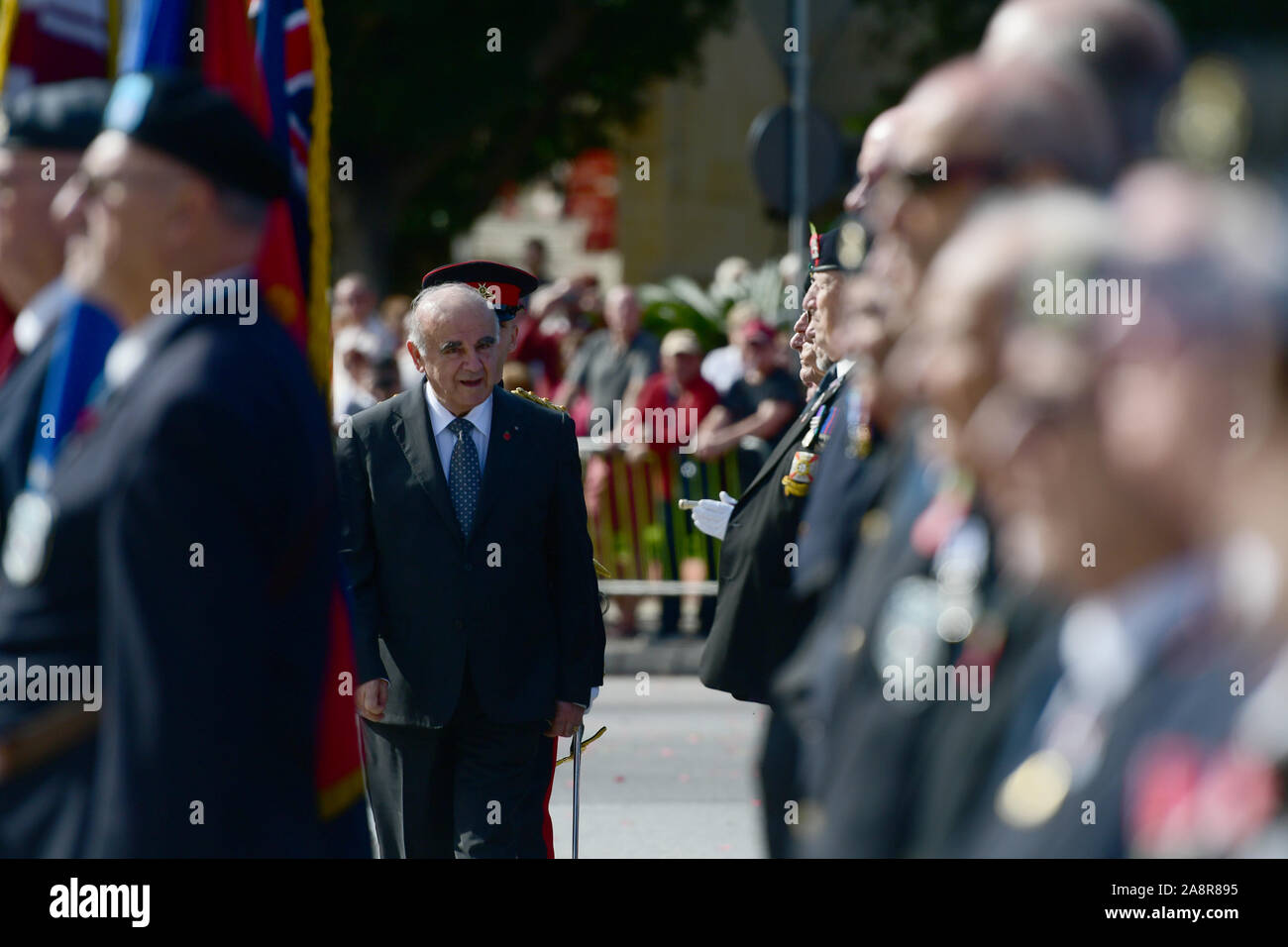 (191110) -- FLORIANA (MALTA), Nov. 10, 2019 (Xinhua) -- Malta's President George Vella (C) reviews former servicemen during the Remembrance Day ceremony in Floriana, Malta, on Nov. 10, 2019. Malta marked Remembrance Day to salute the war dead on Sunday. (Photo by Jonathan Borg/Xinhua) Stock Photo