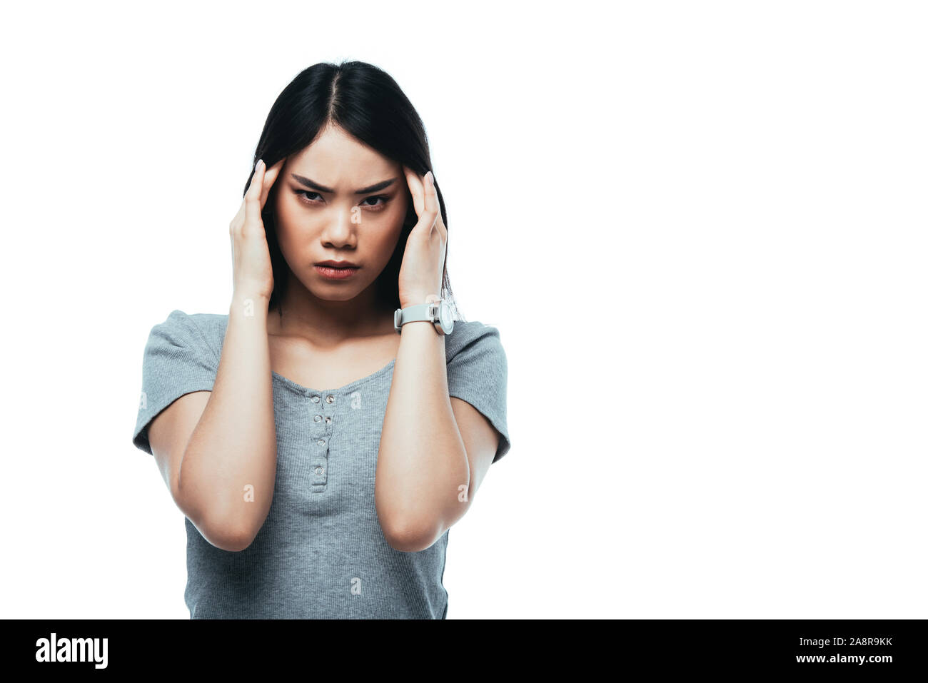 attractive asian girl suffering from migraine isolated on white Stock Photo