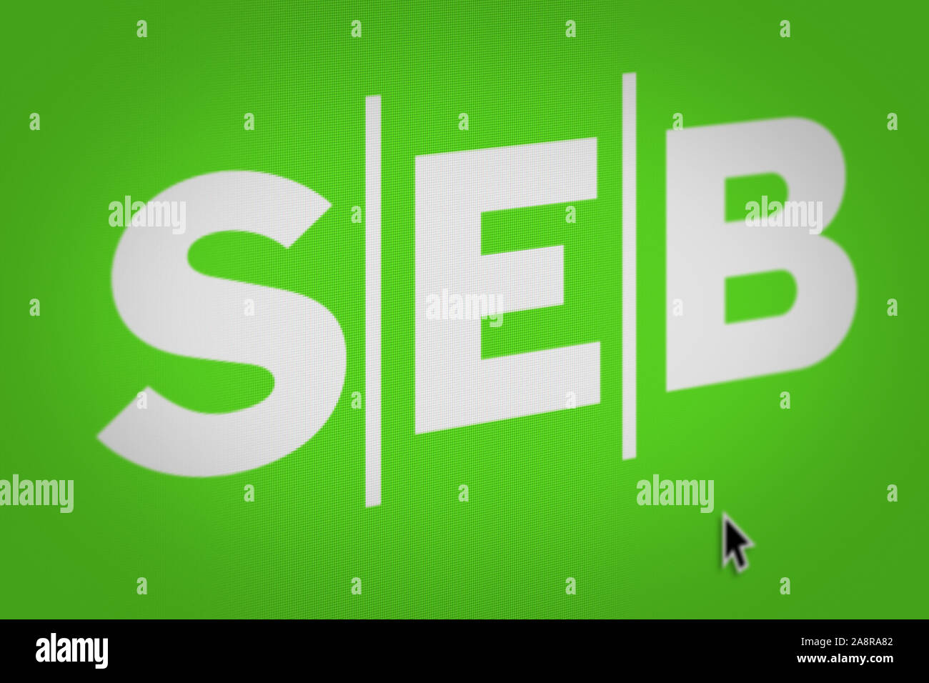 Logo of the public company SEB displayed on a computer screen in close-up. Credit: PIXDUCE Stock Photo