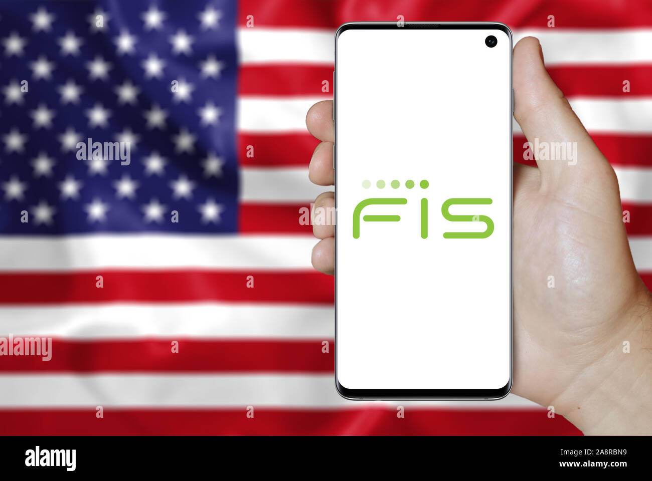 Logo of public company Fidelity National Information Services displayed on a smartphone. Flag of USA background. Credit: PIXDUCE Stock Photo