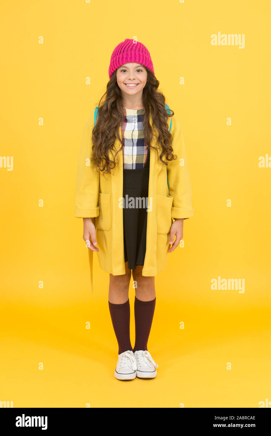 Modern outfit for daily life. Adorable schoolgirl winter outfit. Schoolgirl street style clothes outfit with backpack. Fashion accessory. Teen fashion. Girl little fashionable cutie wear knitted hat S...