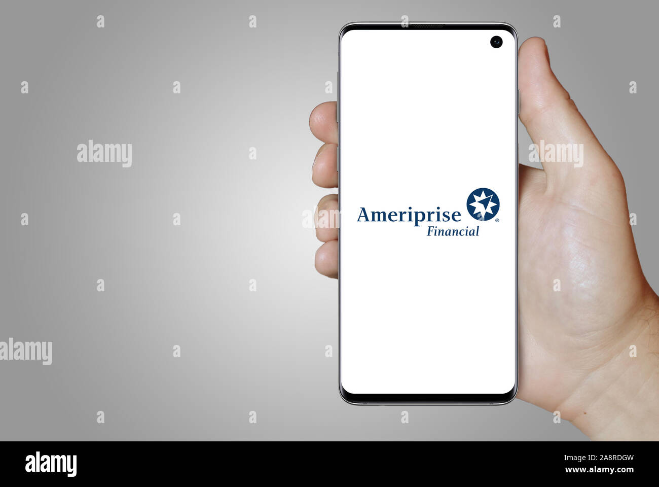 Logo of public company Ameriprise Financial displayed on a smartphone. Grey  background. Credit: PIXDUCE Stock Photo - Alamy