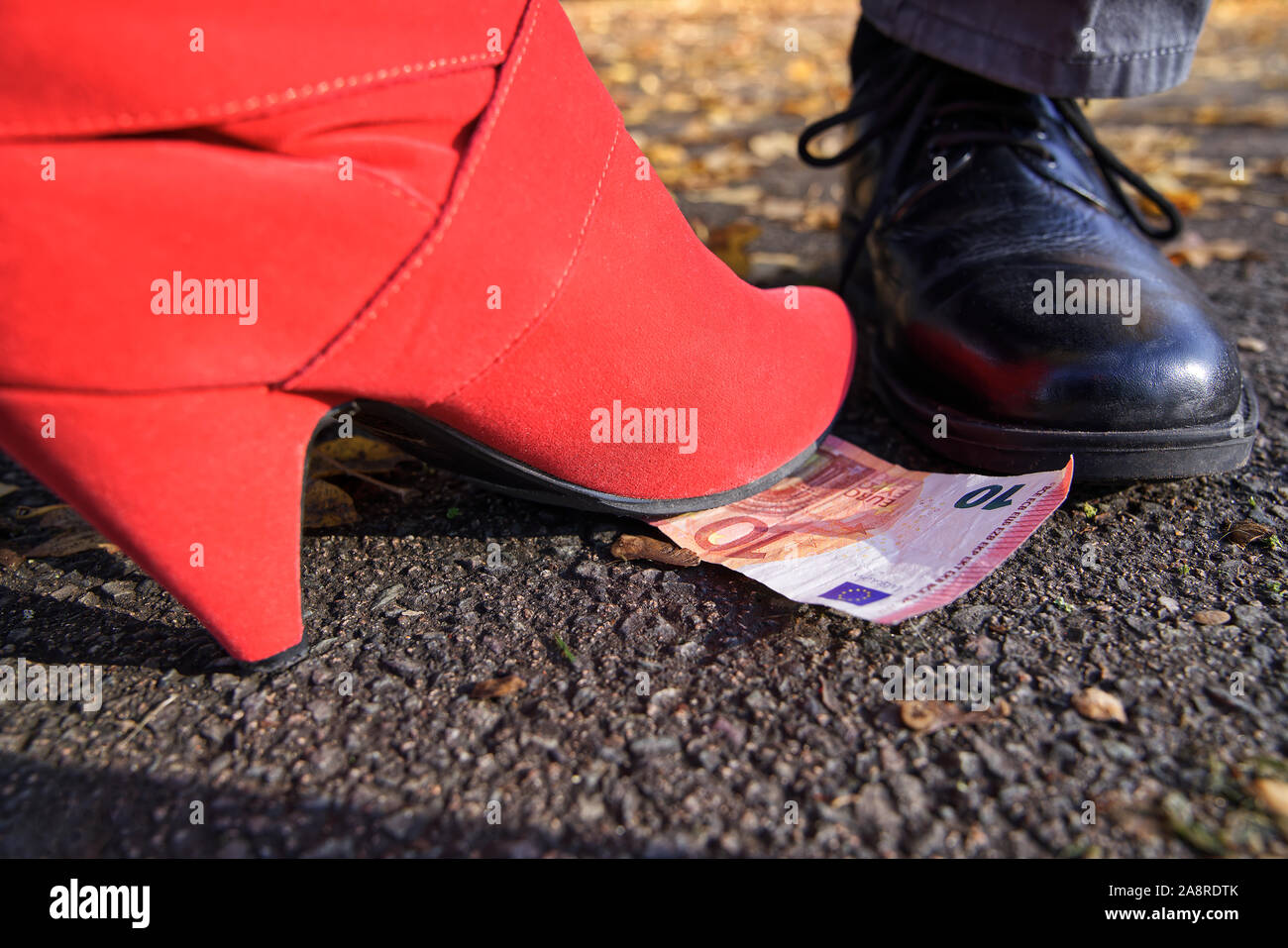 Finding money on the floor Stock Photo