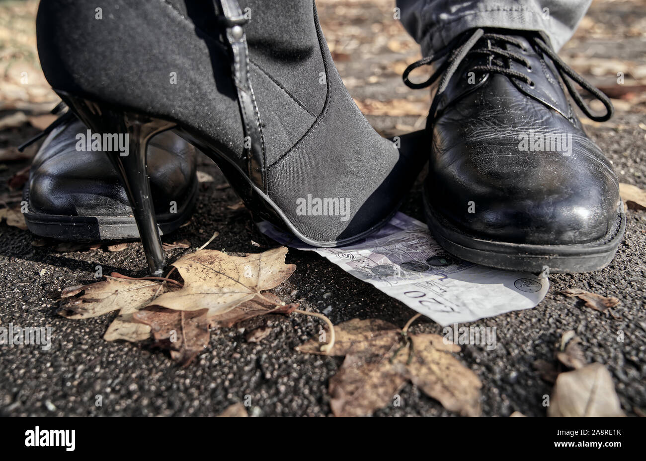 Finding money on the floor Stock Photo