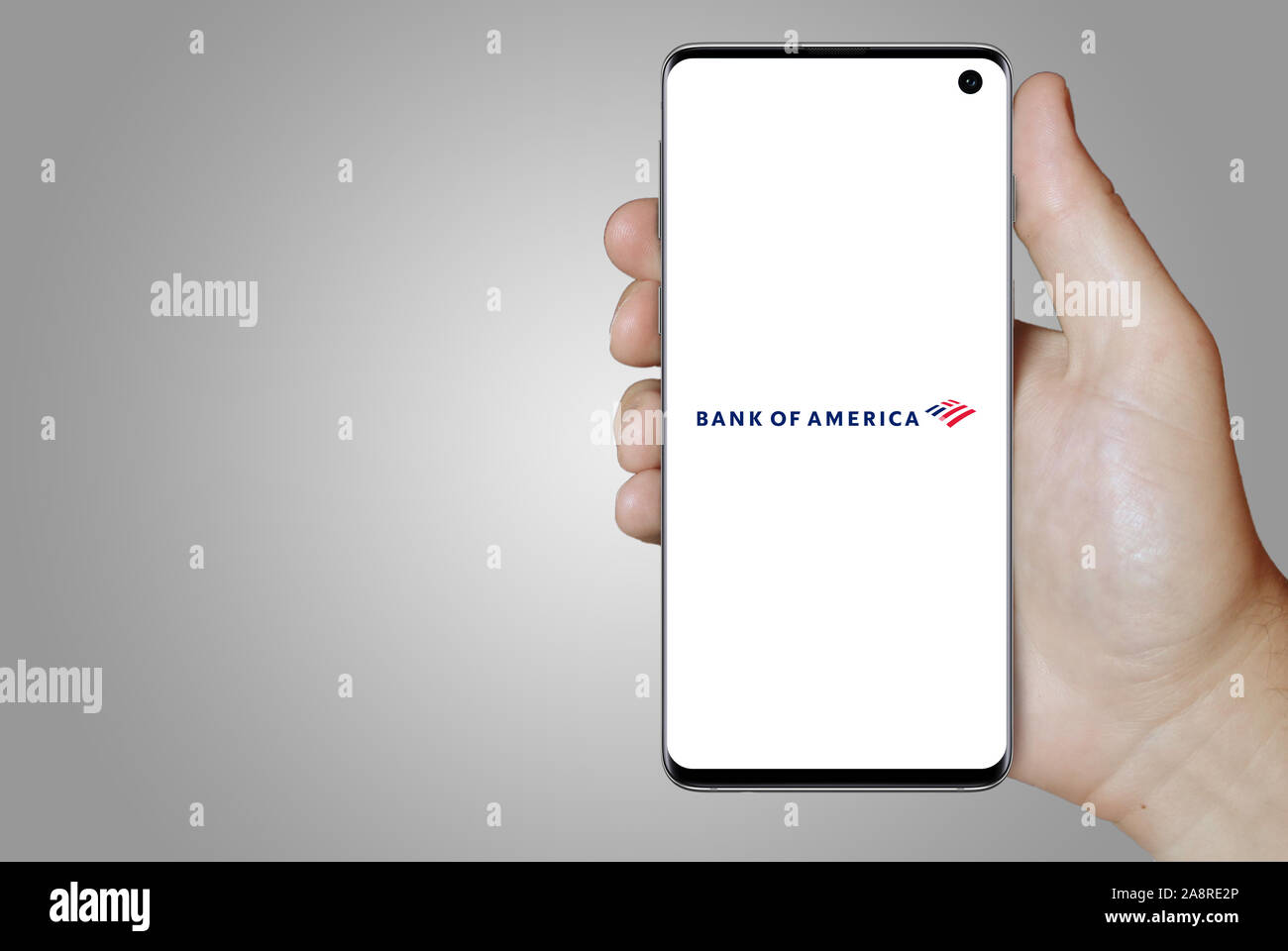 Logo of public company Bank of America Corp displayed on a smartphone. Grey background. Credit: PIXDUCE Stock Photo