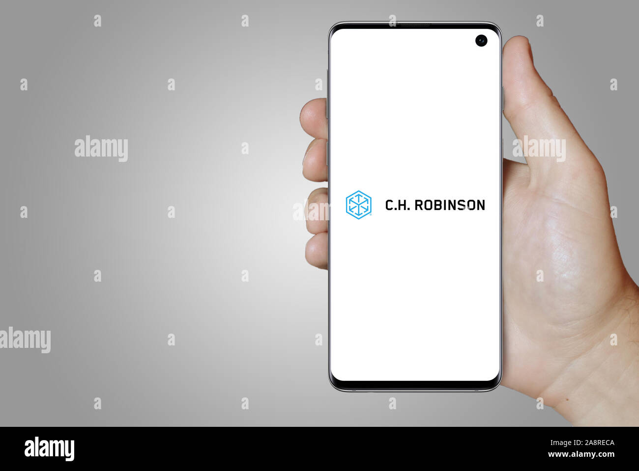 Logo of public company C. H. Robinson Worldwide displayed on a smartphone. Grey background. Credit: PIXDUCE Stock Photo