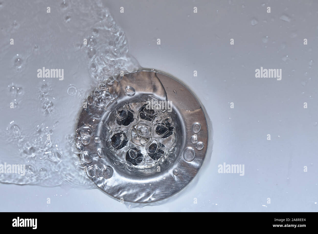 Bathroom sink drain Stock Photo - Alamy
