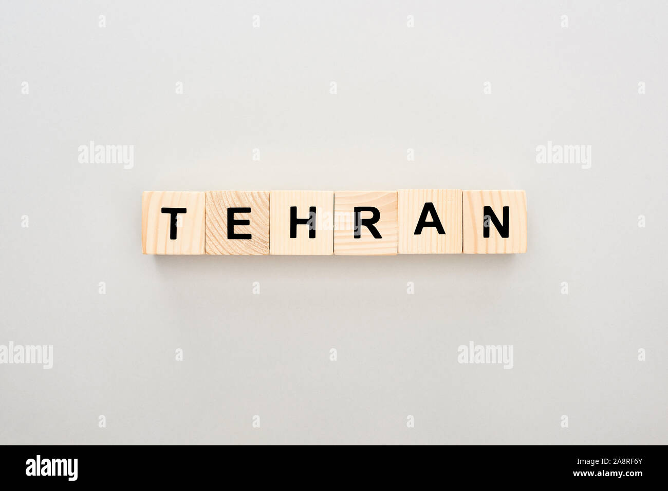 Tehran Lettering top view of wooden blocks with Tehran lettering on white background ...
