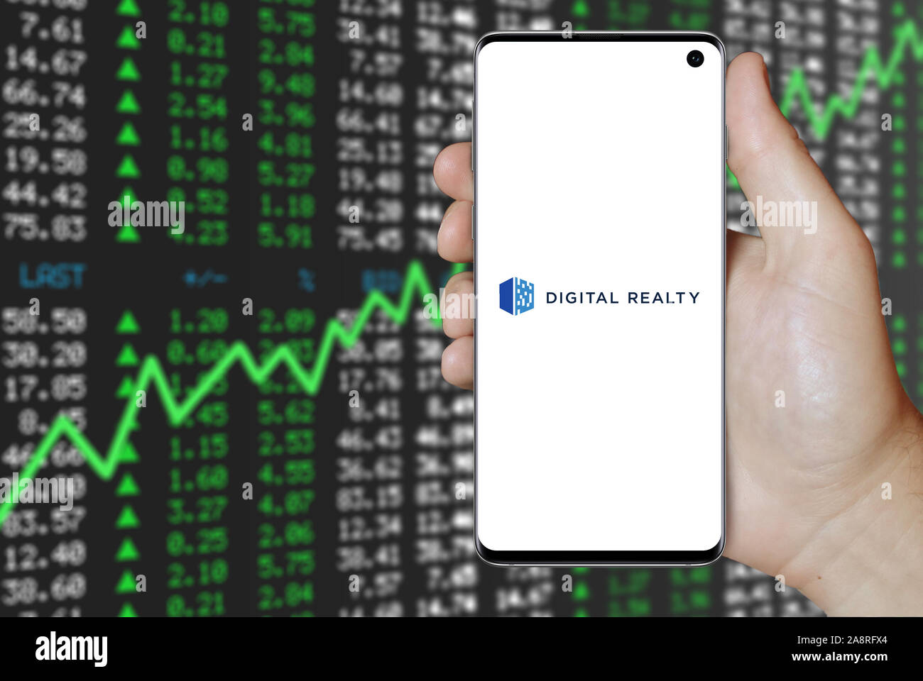 Logo of public company Digital Realty Trust Inc displayed on a smartphone. Positive stock market background. Credit: PIXDUCE Stock Photo