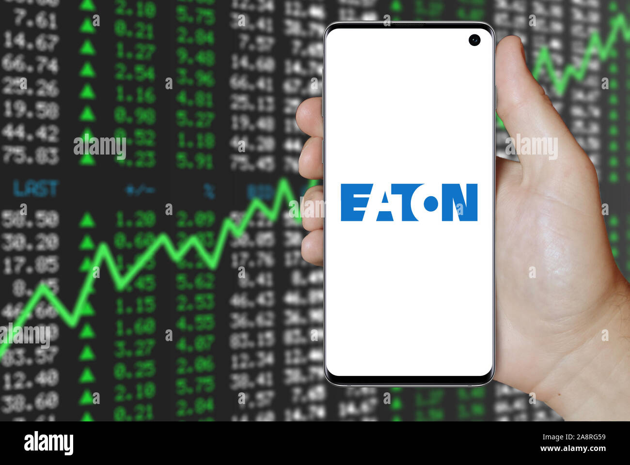 Logo of public company Eaton Corporation displayed on a smartphone. Positive stock market background. Credit: PIXDUCE Stock Photo