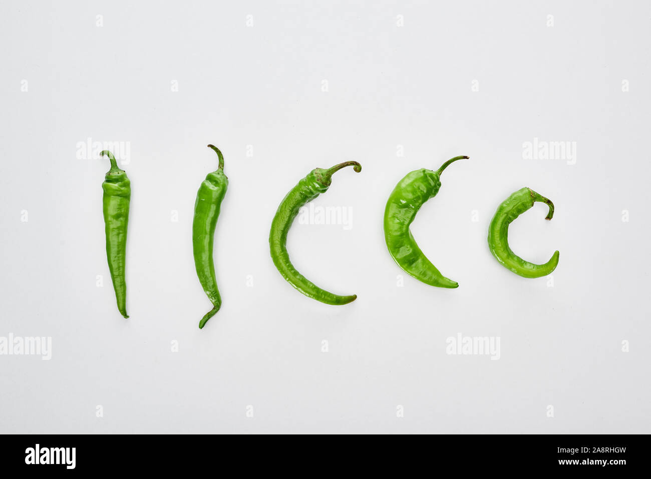 top view of green and whole peppers on white background Stock Photo - Alamy