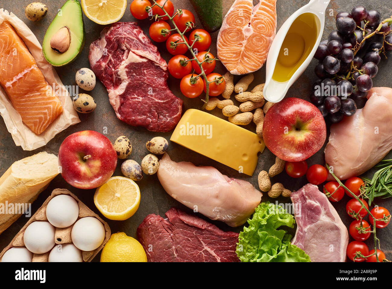 Top view of assorted meat, poultry, fish, eggs, fruits, vegetables