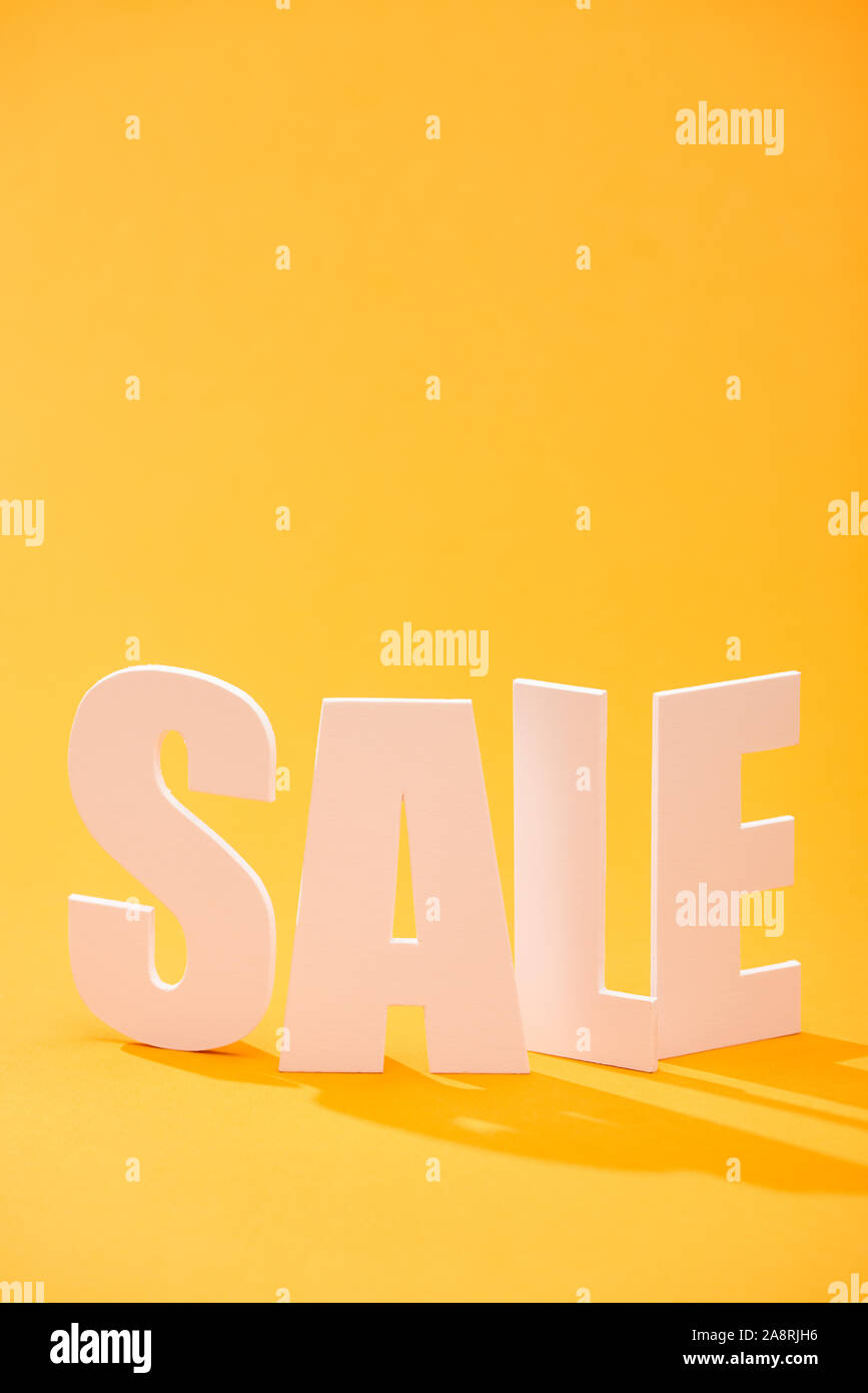 white sale lettering on bright orange background Stock Photo Alamy