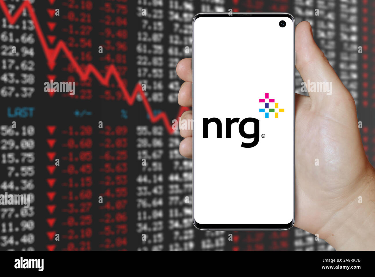 Logo of public company NRG Energy displayed on a smartphone. Negative stock market background. Credit: PIXDUCE Stock Photo